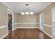 Traditional dining room offers hardwood floors and large windows at 345 Riverstone Dr, Hiram, GA 30141