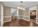 Traditional dining room offers hardwood floors and views of other rooms at 345 Riverstone Dr, Hiram, GA 30141