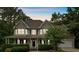 Charming two-story home with a welcoming front porch and manicured landscaping at 345 Riverstone Dr, Hiram, GA 30141