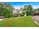 Charming two-story home with a welcoming front porch and lush green lawn at 345 Riverstone Dr, Hiram, GA 30141