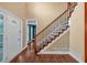 Inviting foyer with hardwood floors, staircase, and view to another room at 345 Riverstone Dr, Hiram, GA 30141