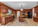 Well-appointed kitchen with granite countertops, tile backsplash, stainless steel appliances and a center island at 345 Riverstone Dr, Hiram, GA 30141