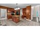 Open kitchen featuring a center island, breakfast bar, stainless steel appliances and built in desk at 345 Riverstone Dr, Hiram, GA 30141