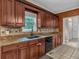 Kitchen featuring granite countertops, tile backsplash, stainless steel appliances, and plenty of cabinet space at 345 Riverstone Dr, Hiram, GA 30141