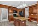 Spacious kitchen featuring a large island, black appliances, breakfast bar, and access to the dining room at 345 Riverstone Dr, Hiram, GA 30141
