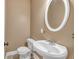 Clean half-bathroom features a white pedestal sink and modern fixtures at 345 Riverstone Dr, Hiram, GA 30141