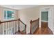 Staircase featuring wood and iron detailing with natural light at 345 Riverstone Dr, Hiram, GA 30141