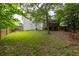 Backyard featuring a deck, grassy area, and privacy fence, perfect for outdoor gatherings and recreation at 4435 Grove Nw Dr, Acworth, GA 30101