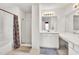 Bright bathroom featuring a tub, a glass-enclosed shower, and double vanities, offering modern conveniences at 4435 Grove Nw Dr, Acworth, GA 30101
