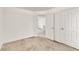 Bright and airy bedroom featuring carpeted floors and natural light at 4435 Grove Nw Dr, Acworth, GA 30101
