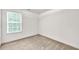 Bedroom featuring natural light with carpeted floors at 4435 Grove Nw Dr, Acworth, GA 30101