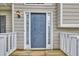 Entryway with a classic blue front door flanked by sidelights and white railing, offering a welcoming entrance at 4435 Grove Nw Dr, Acworth, GA 30101