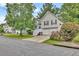 Charming two-story home featuring neutral siding, black shutters, two-car garage, and a well-manicured front lawn at 4435 Grove Nw Dr, Acworth, GA 30101