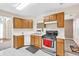 Open kitchen with wooden cabinetry and stainless steel gas range at 4435 Grove Nw Dr, Acworth, GA 30101