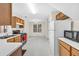 Functional kitchen with gas range, natural light, and white appliances at 4435 Grove Nw Dr, Acworth, GA 30101