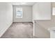This is an open living room with a carpeted floor and ample natural light at 4435 Grove Nw Dr, Acworth, GA 30101