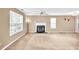 Bright living room featuring fireplace, large window, and ceiling fan at 4435 Grove Nw Dr, Acworth, GA 30101