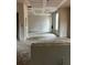 Spacious room awaiting finishing touches with ample natural light from a window at 1716 Hickory Heights (Lot 2) Way, Acworth, GA 30102