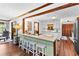 Bright kitchen island with white cabinets and stainless steel appliances at 217 Cedar Trl, Jonesboro, GA 30238