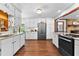 Bright eat-in kitchen with granite countertops, stainless steel appliances, hardwood floors and recessed lighting at 217 Cedar Trl, Jonesboro, GA 30238