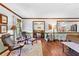 Spacious living room featuring hardwood floors, neutral tones, and open access to the dining area and kitchen at 217 Cedar Trl, Jonesboro, GA 30238