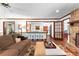 Cozy living room with fireplace that connects to kitchen and other rooms at 217 Cedar Trl, Jonesboro, GA 30238