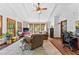 Spacious living room with wood floors, natural light, beamed ceilings, and white shiplap walls at 217 Cedar Trl, Jonesboro, GA 30238
