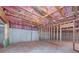 Unfinished basement featuring exposed pink insulation and framed walls at 7804 Gusty Trl, Douglasville, GA 30135