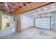 View of the basement featuring an unfinished garage door, bathroom, and concrete floor at 7804 Gusty Trl, Douglasville, GA 30135