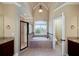 Spacious bathroom showcasing a tub under a window, dual sinks, and a glass shower at 7804 Gusty Trl, Douglasville, GA 30135