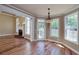 Bright living room with fireplace, hardwood floors, and elegant trim work at 7804 Gusty Trl, Douglasville, GA 30135