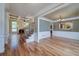 Elegant living room with hardwood floors, coffered ceilings, fireplace, and ample natural light at 7804 Gusty Trl, Douglasville, GA 30135