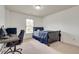 Bright bedroom featuring plush carpet, a desk, and a large window offering plenty of natural light at 8360 Village School Dr, Cumming, GA 30041
