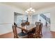 Dining room with a view to the kitchen and staircase at 8360 Village School Dr, Cumming, GA 30041