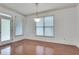 Dining room with natural light from large windows and a glass door to the backyard at 8360 Village School Dr, Cumming, GA 30041