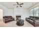 Bright living room with neutral carpet and a fireplace at 8360 Village School Dr, Cumming, GA 30041