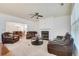Spacious living room with a fireplace, and dining area at 8360 Village School Dr, Cumming, GA 30041