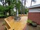 Wooden deck area with outdoor seating and lush greenery at 1177 Baker Ln, Marietta, GA 30062
