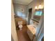 Neutral toned bathroom with a walk-in shower and pedestal sink vanity at 1177 Baker Ln, Marietta, GA 30062