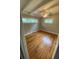 Bright bedroom with hardwood floors, two windows and a ceiling fan at 1177 Baker Ln, Marietta, GA 30062