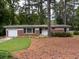 Charming brick home with well-maintained lawn and mature trees at 1177 Baker Ln, Marietta, GA 30062