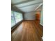 Bright living room featuring hardwood floors, large windows, and neutral paint at 1177 Baker Ln, Marietta, GA 30062