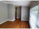 Spacious room with hardwood floors, modern paint, and natural light at 1177 Baker Ln, Marietta, GA 30062