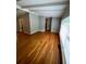 Bright living room with hardwood floors and lots of natural light from the large window at 1177 Baker Ln, Marietta, GA 30062