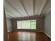 Bright living room featuring hardwood floors, a large window, and modern ceiling at 1177 Baker Ln, Marietta, GA 30062
