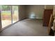 Living room with sliding door to deck and small fireplace at 1177 Baker Ln, Marietta, GA 30062