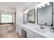 Luxurious bathroom featuring double sinks, a soaking tub, and elegant finishes at 3185 Perch Sw Dr, Marietta, GA 30008