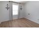 Bright bedroom with large window and light colored floors at 3185 Perch Sw Dr, Marietta, GA 30008