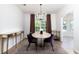 Bright dining room features a round table, modern chandelier, and stylish decor at 3185 Perch Sw Dr, Marietta, GA 30008