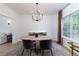 Bright dining room features a round table, modern chandelier, and stylish decor at 3185 Perch Sw Dr, Marietta, GA 30008